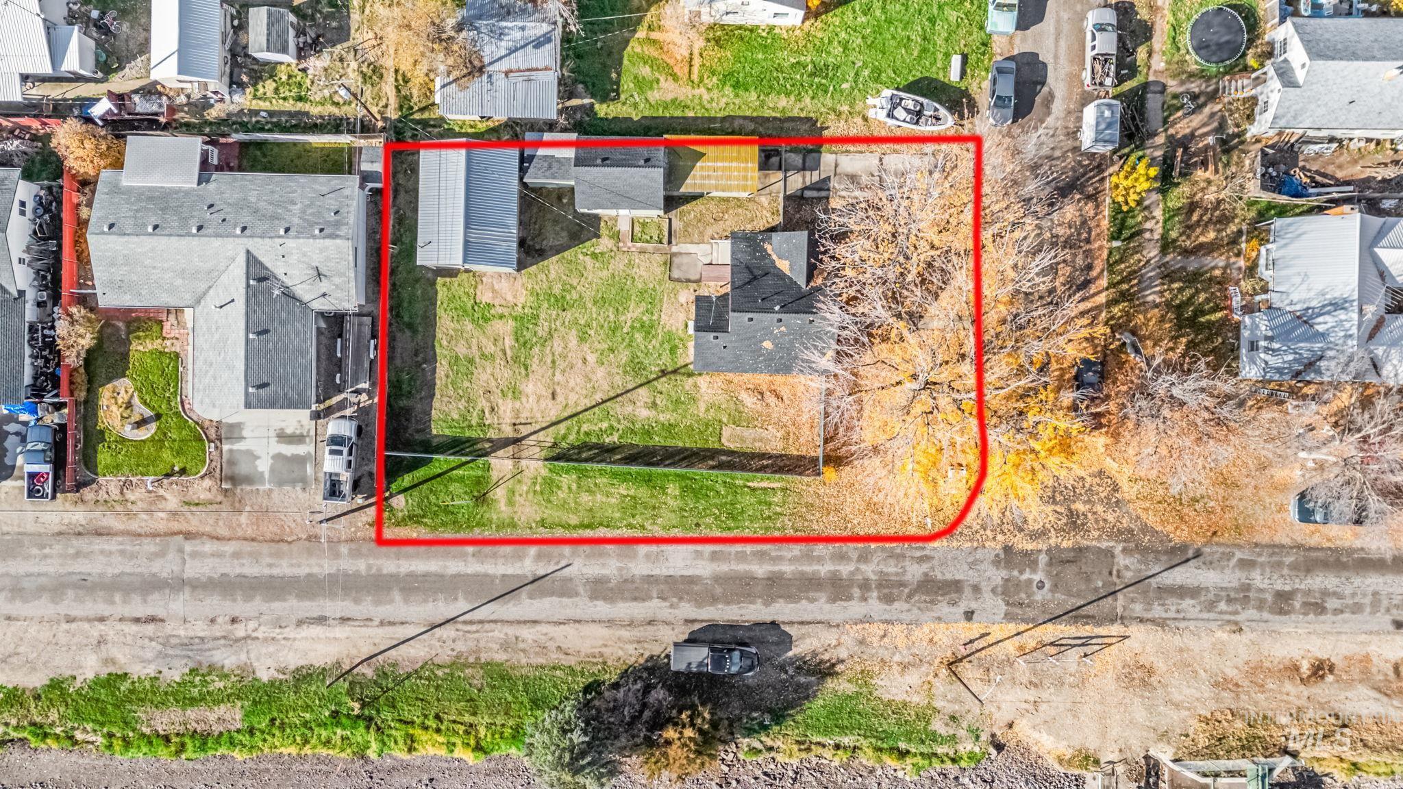 Aerial view of residential area with property parcel outlined