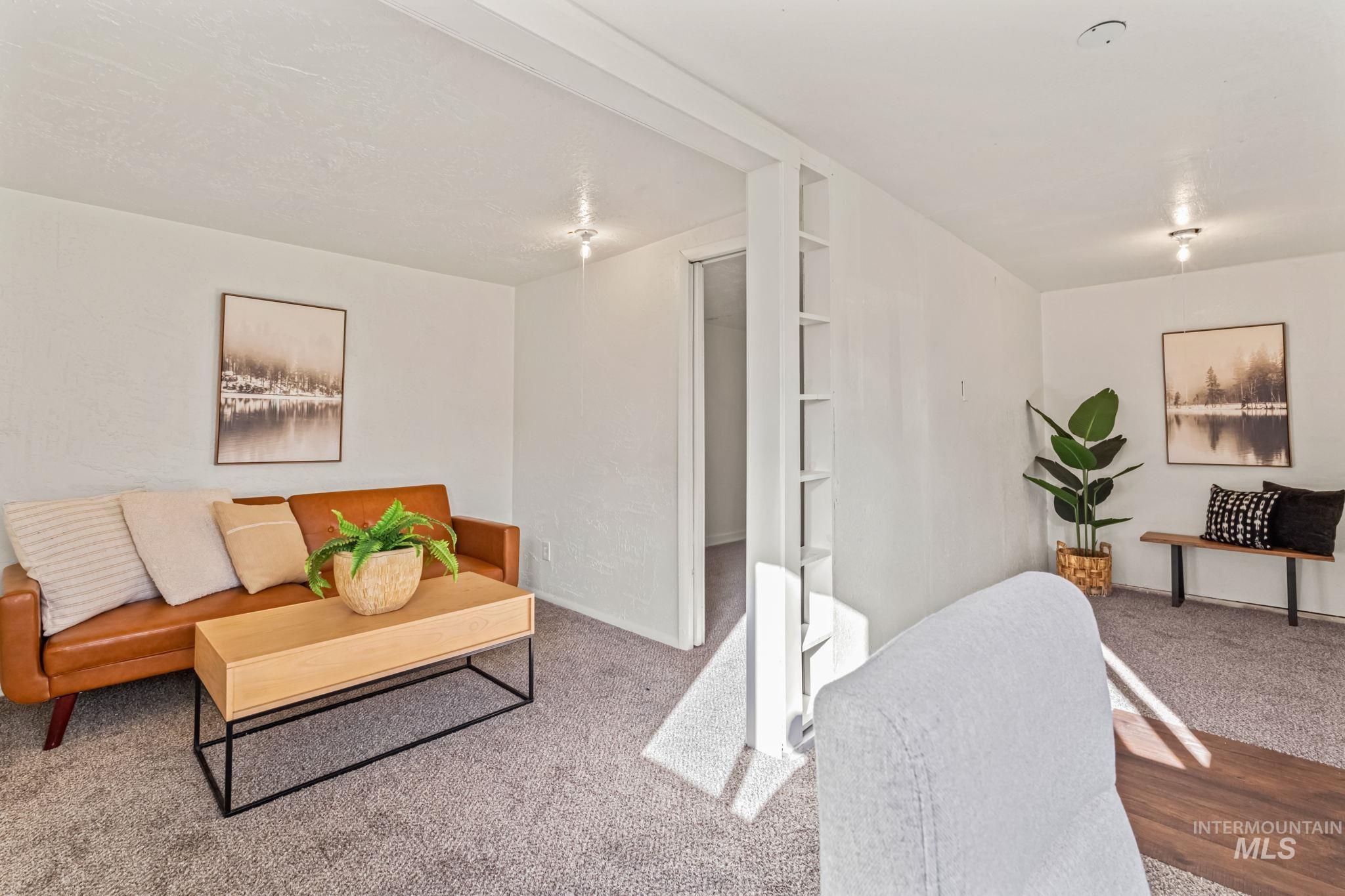 Living room featuring carpet floors