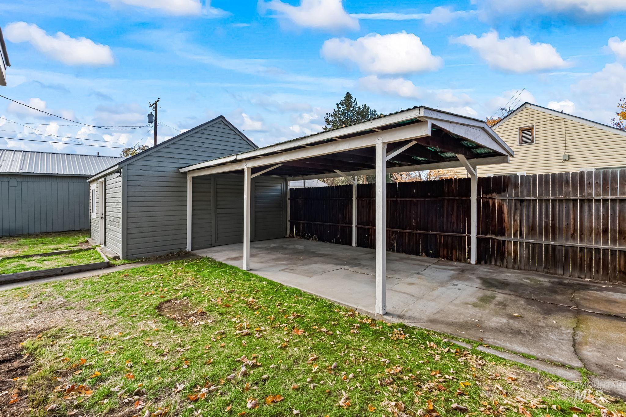 View of outdoor structure with a carport