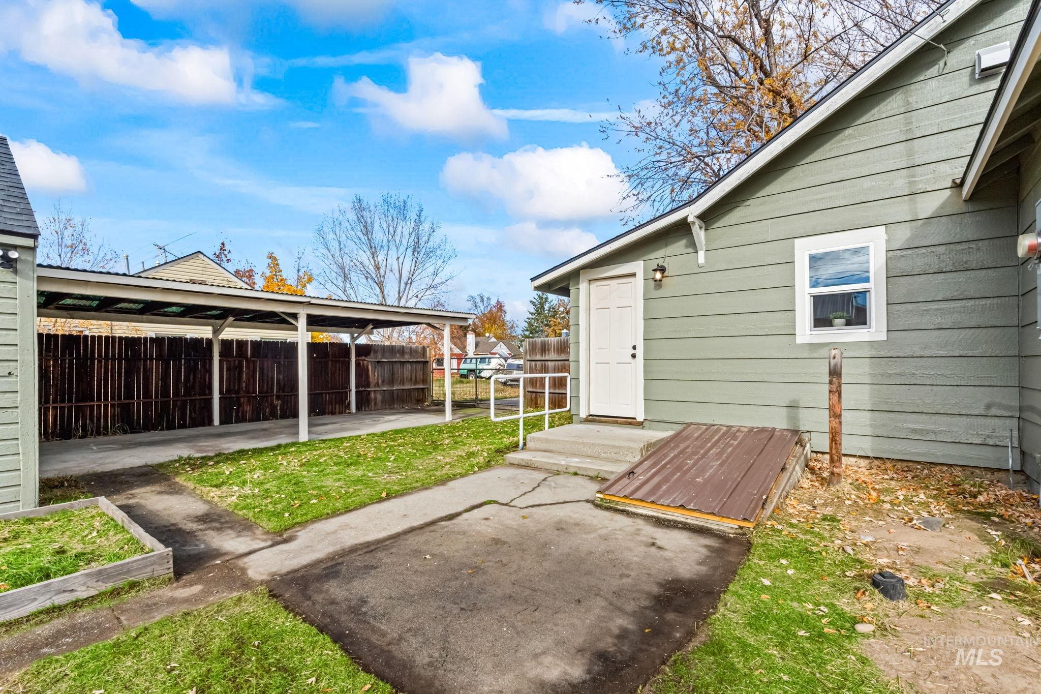 Fenced backyard with a patio area