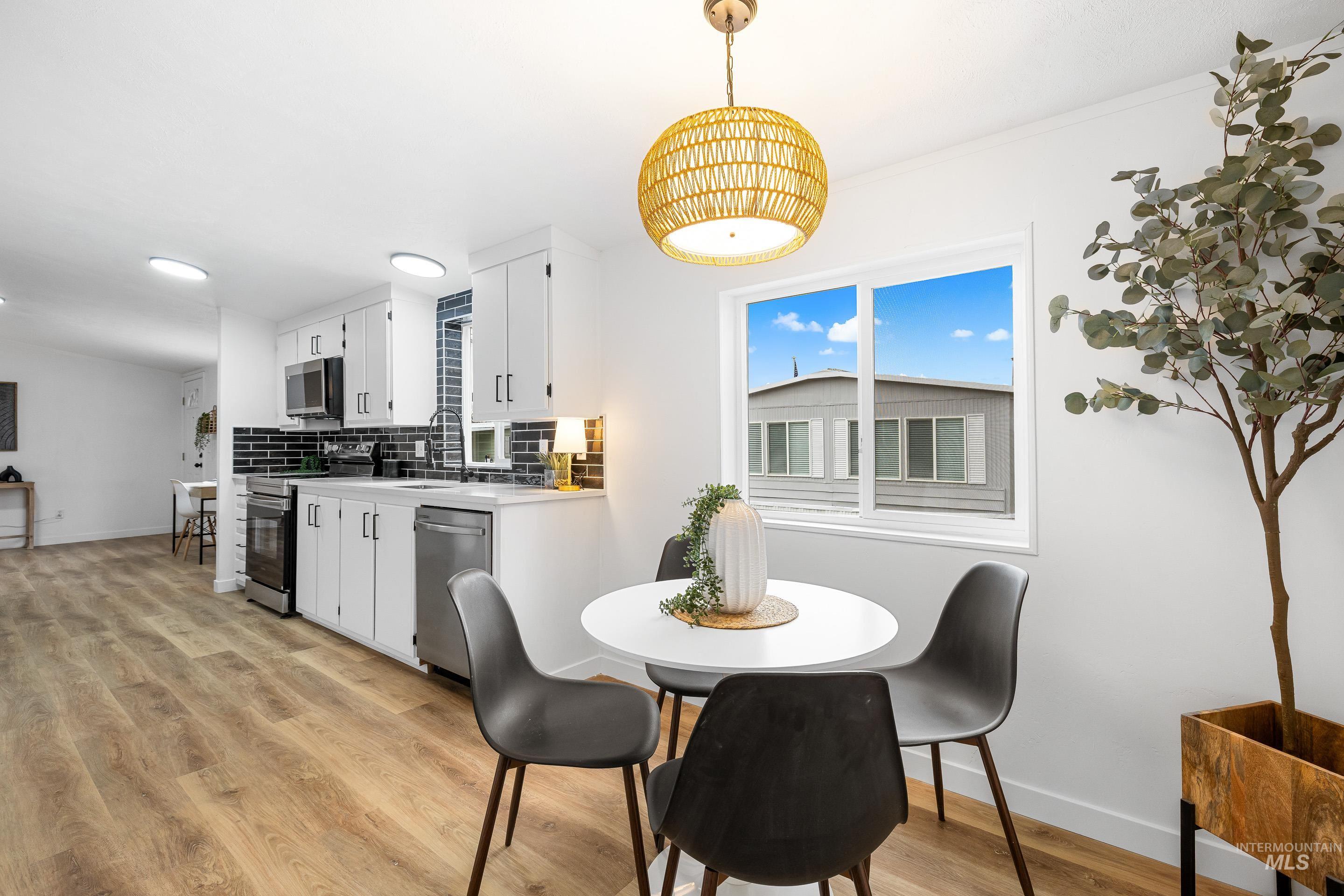 Dining area featuring baseboards and light wood finished floors