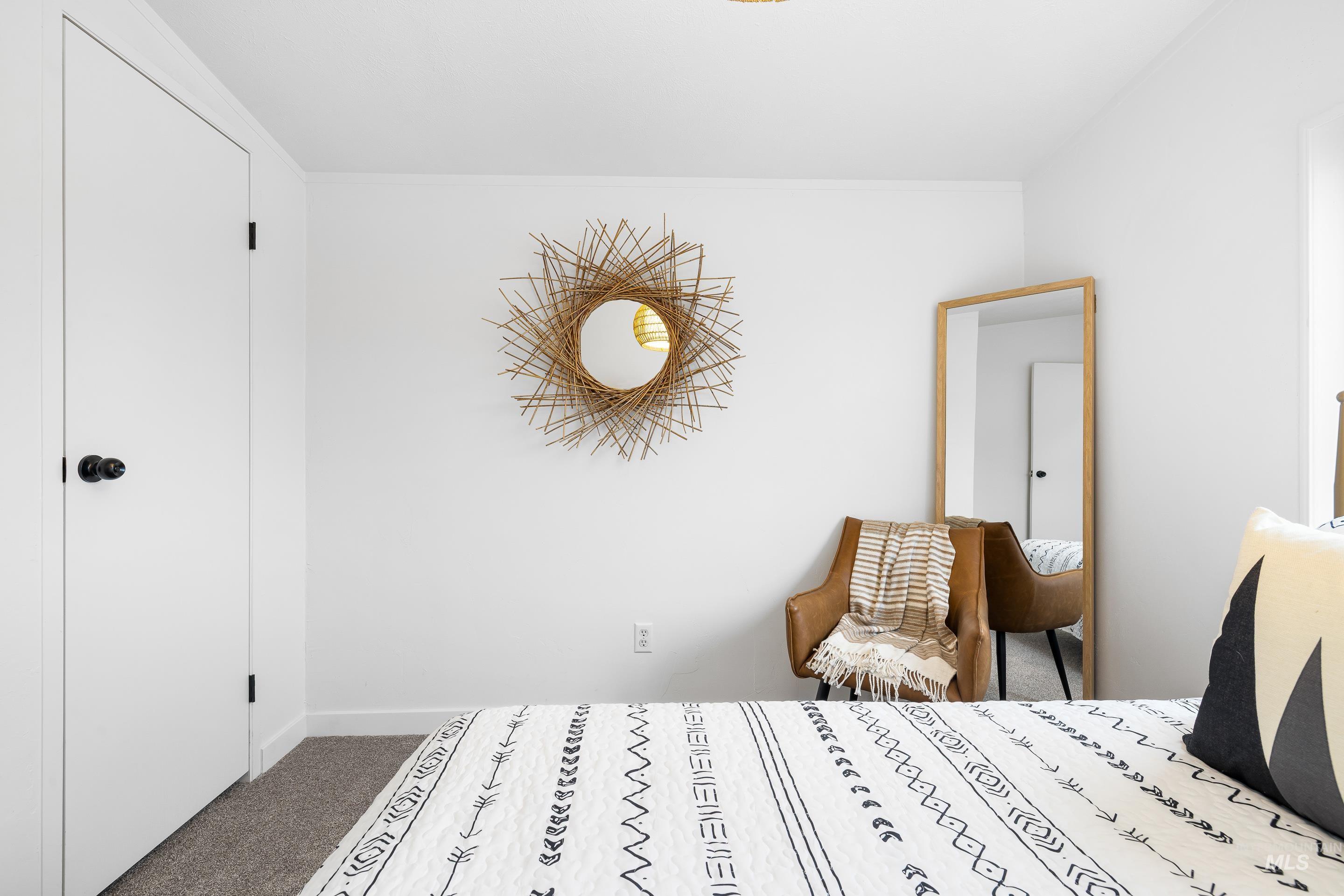 Carpeted bedroom featuring baseboards