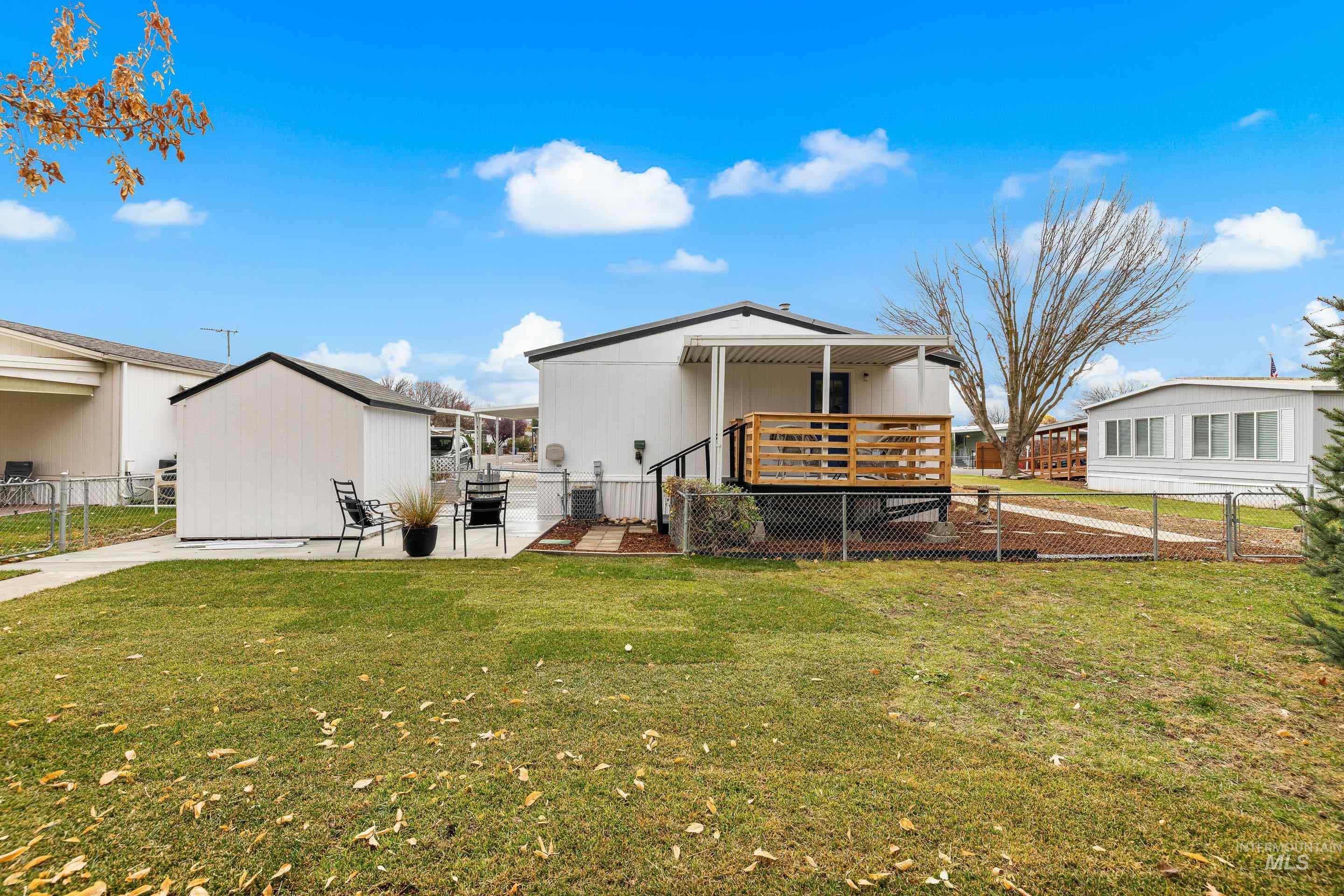 Back of house featuring a patio and a deck