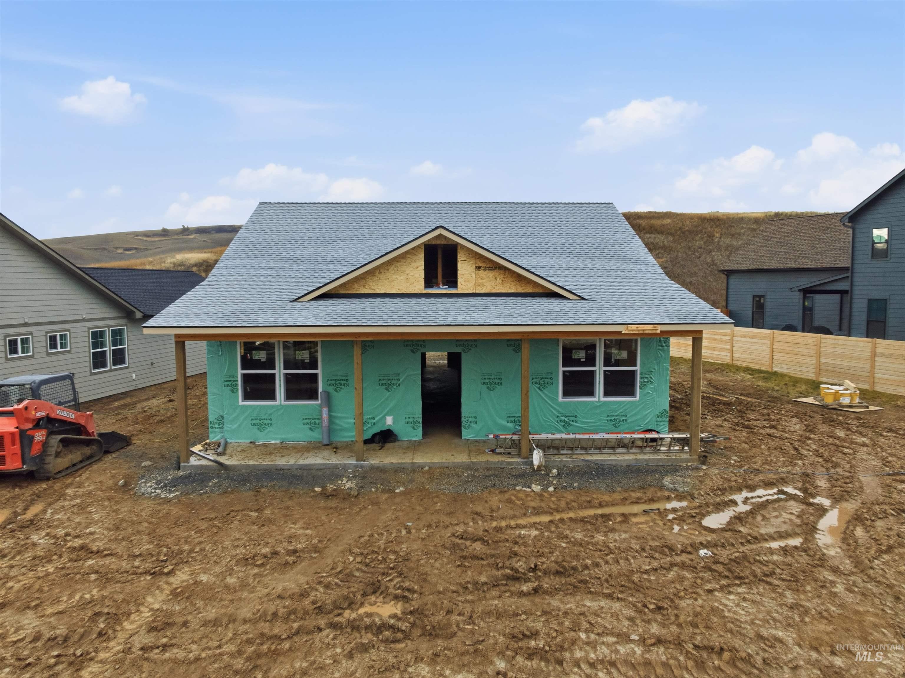 Property under construction with a porch and a shingled roof