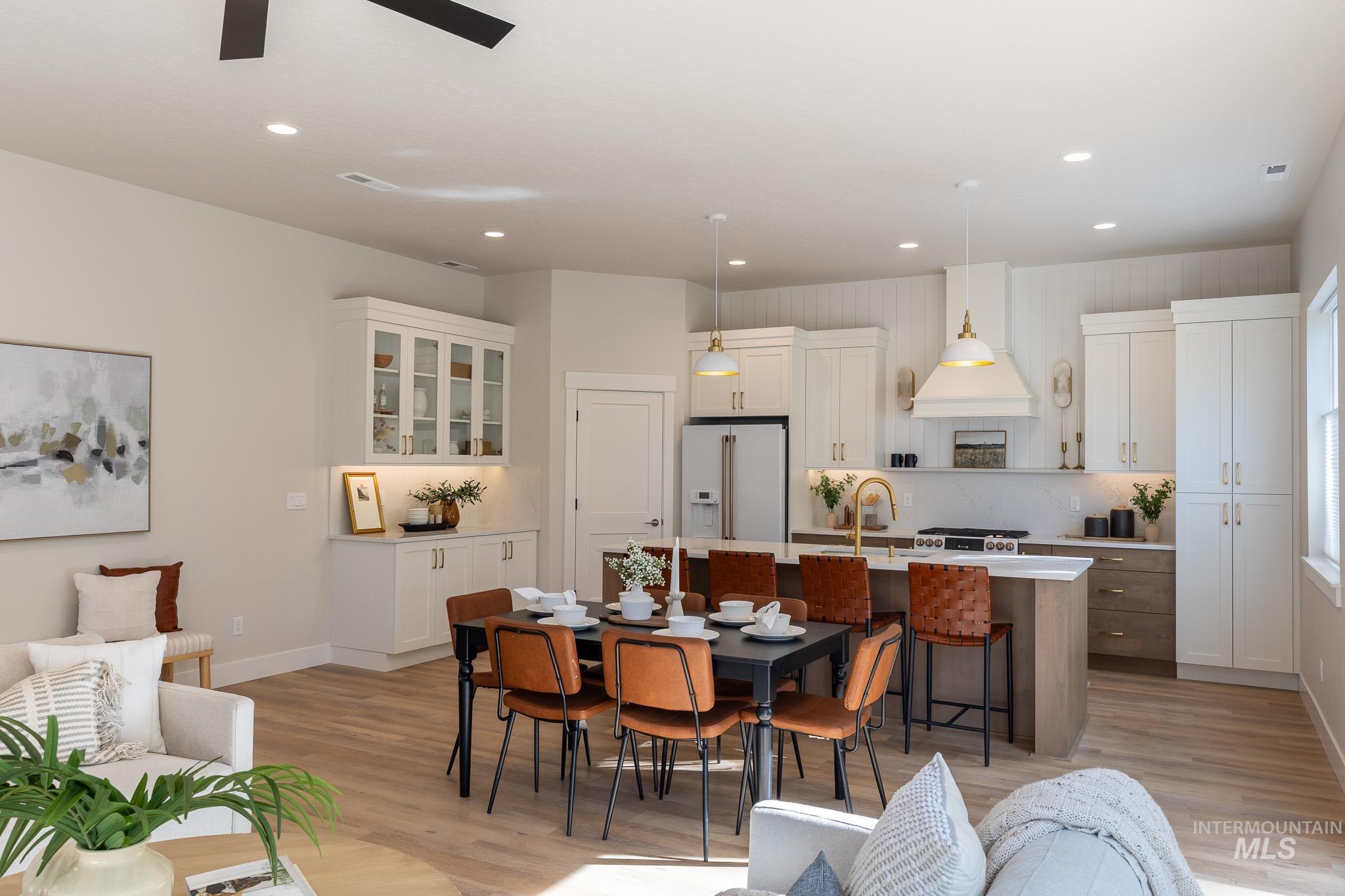 Dining area featuring recessed lighting and light wood-style flooring