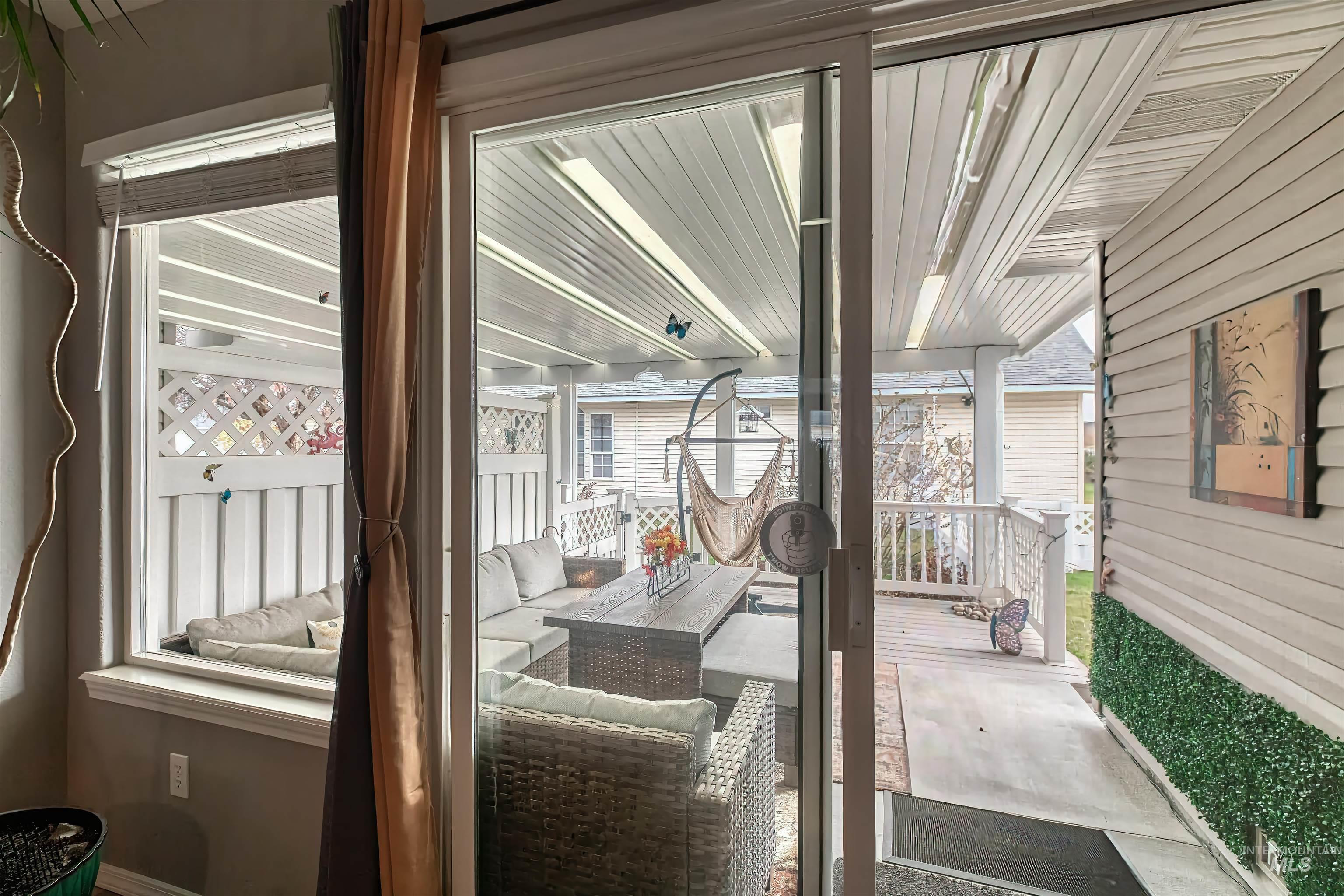 Covered porch featuring an outdoor living space