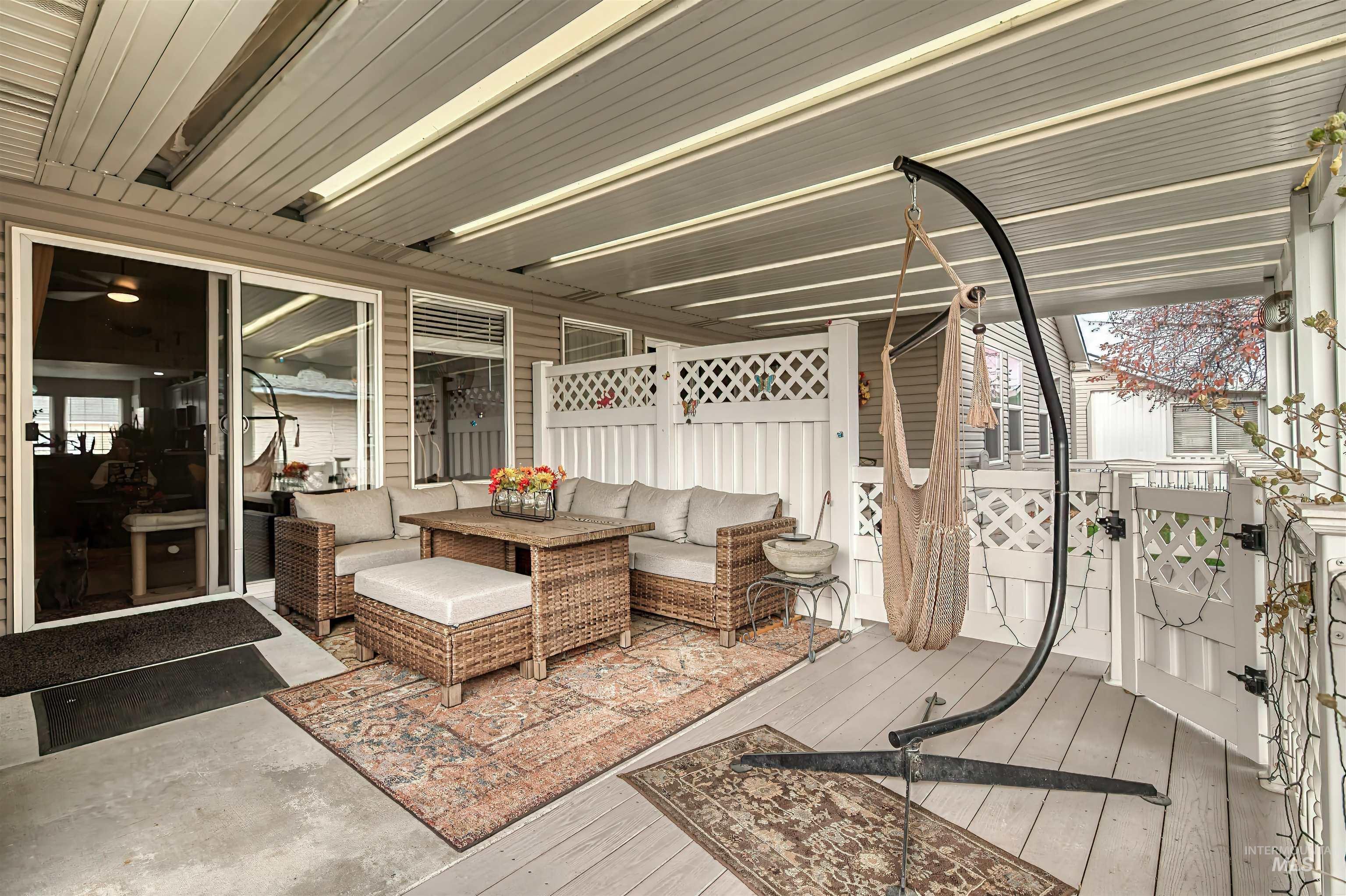View of patio with a deck and an outdoor hangout area