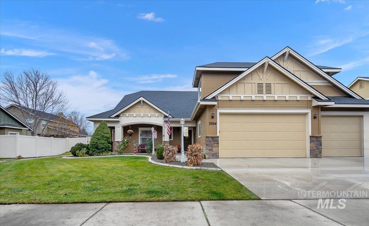 Craftsman-style home with a porch, concrete driveway, stone siding, board and batten siding, and a garage