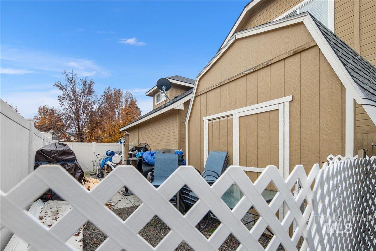 View of side of home featuring a fenced backyard