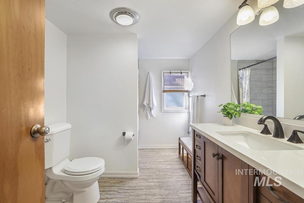 Full bathroom featuring vanity and a shower with curtain