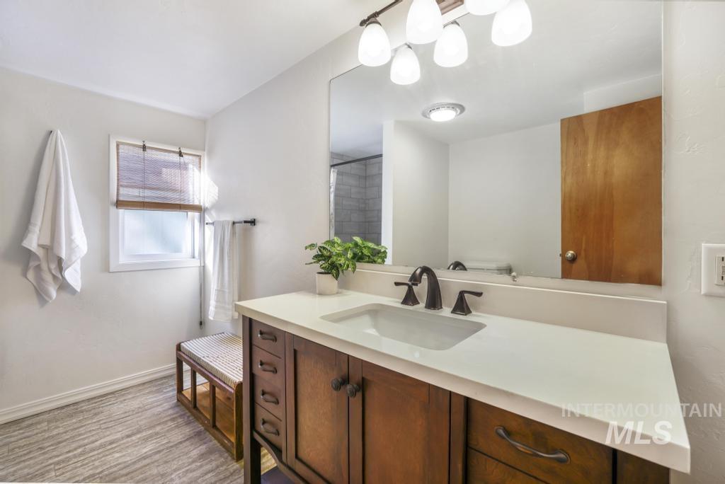 Full bathroom featuring vanity and a shower
