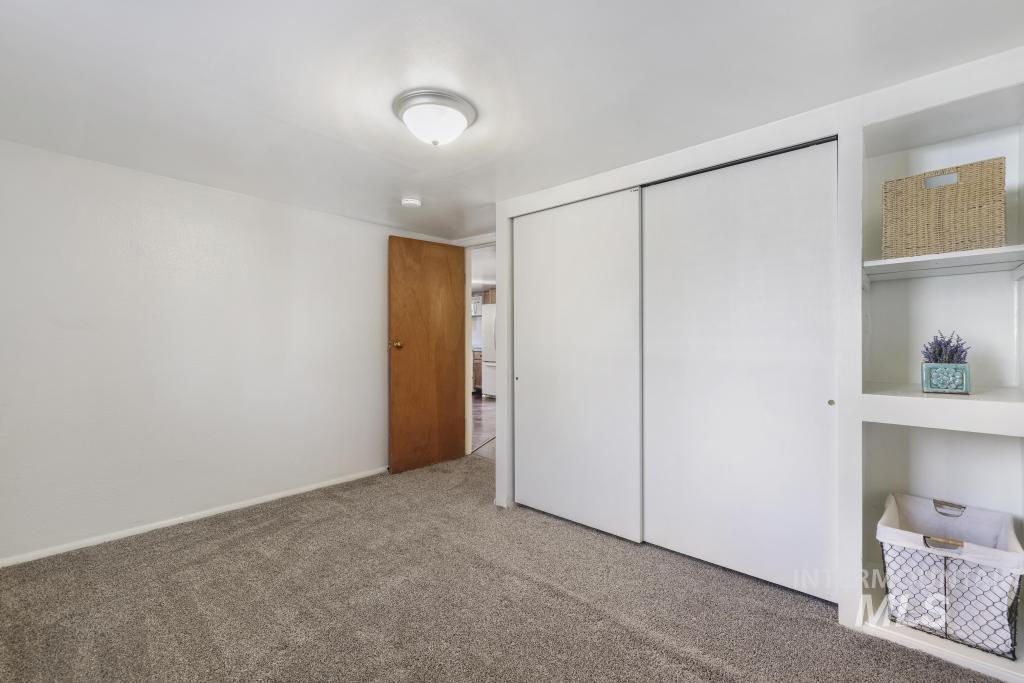 Unfurnished bedroom with a closet and carpet