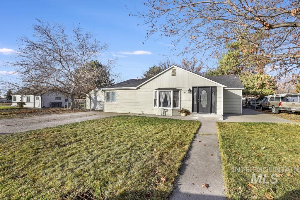 Single story home with a front lawn and roof with shingles