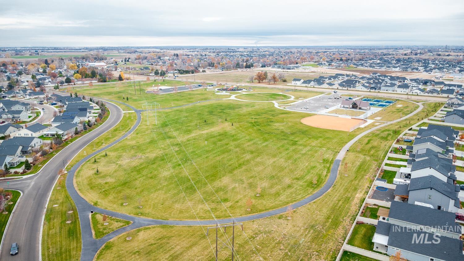 Aerial overview of property's location featuring nearby suburban area