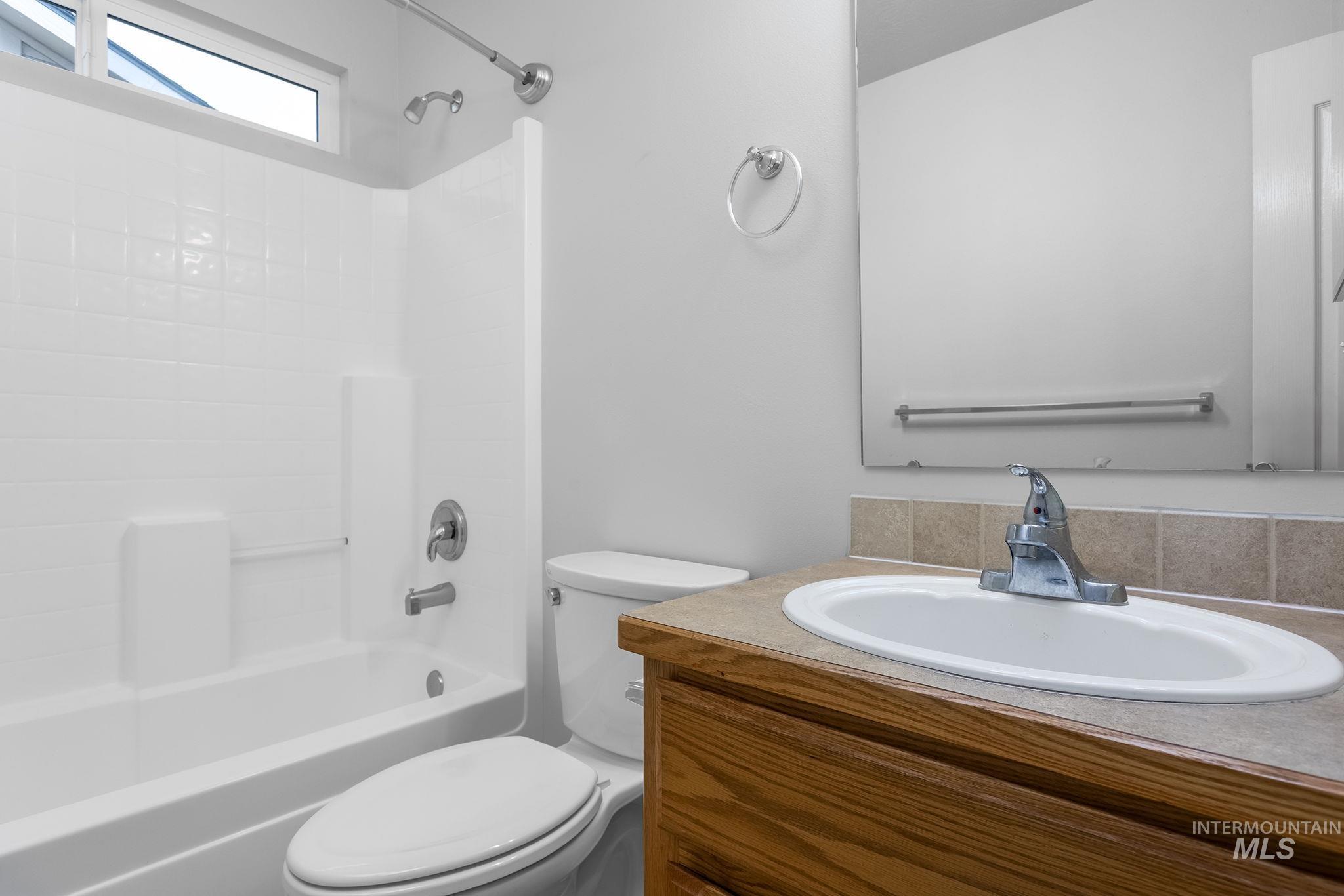 Full bathroom featuring bathing tub / shower combination and vanity