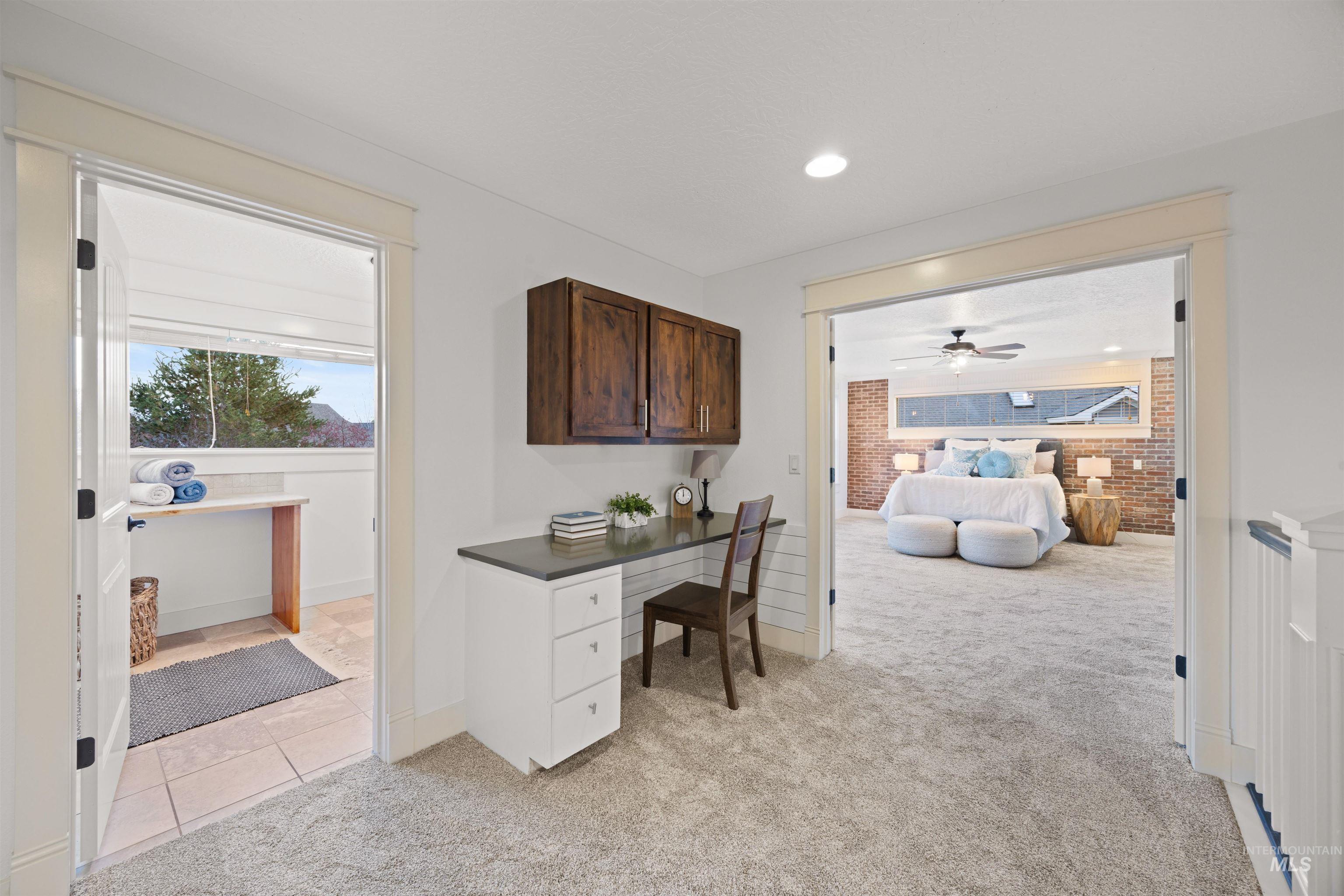 Home office featuring light carpet, light tile patterned floors, recessed lighting, and ceiling fan