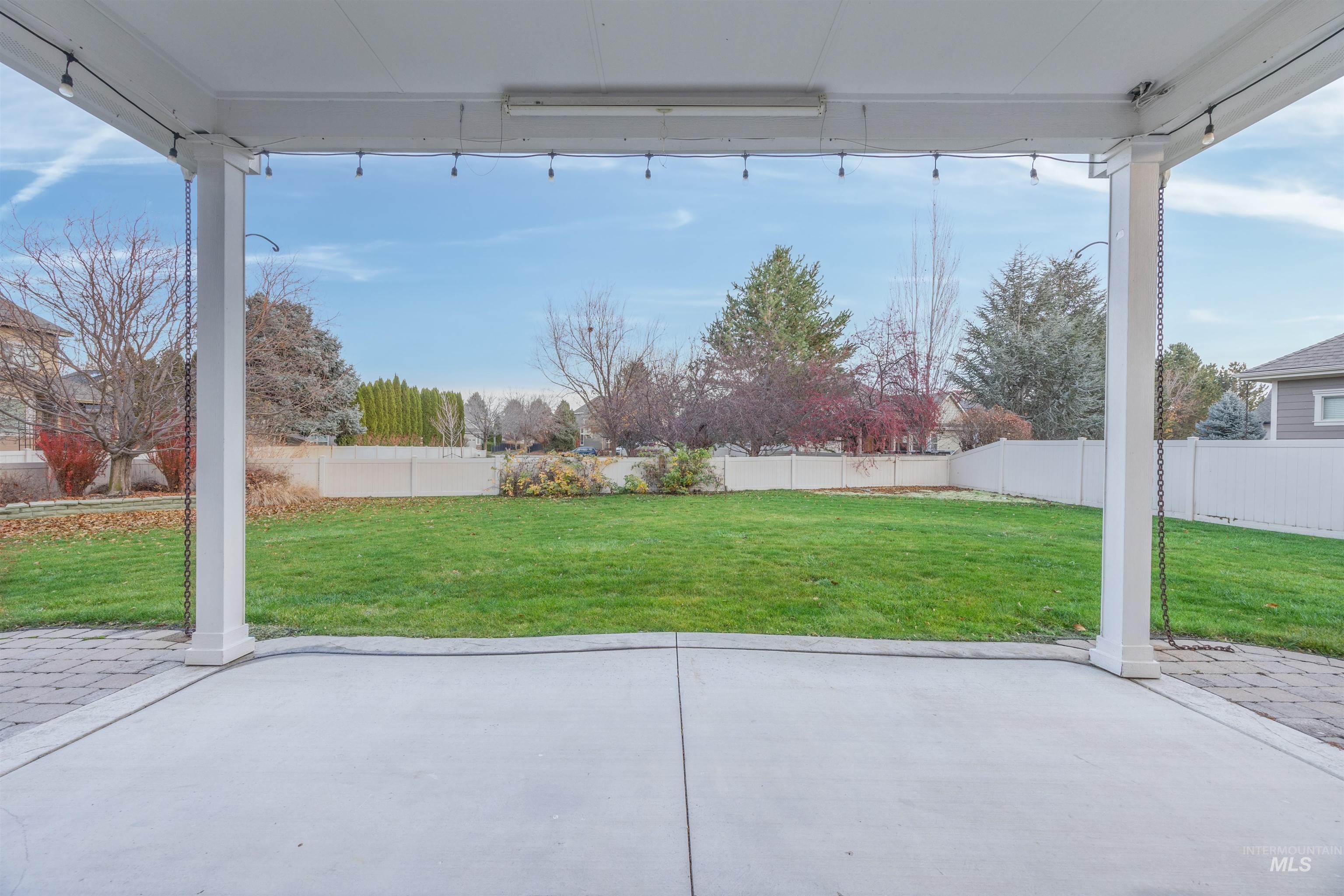Fenced backyard featuring a patio