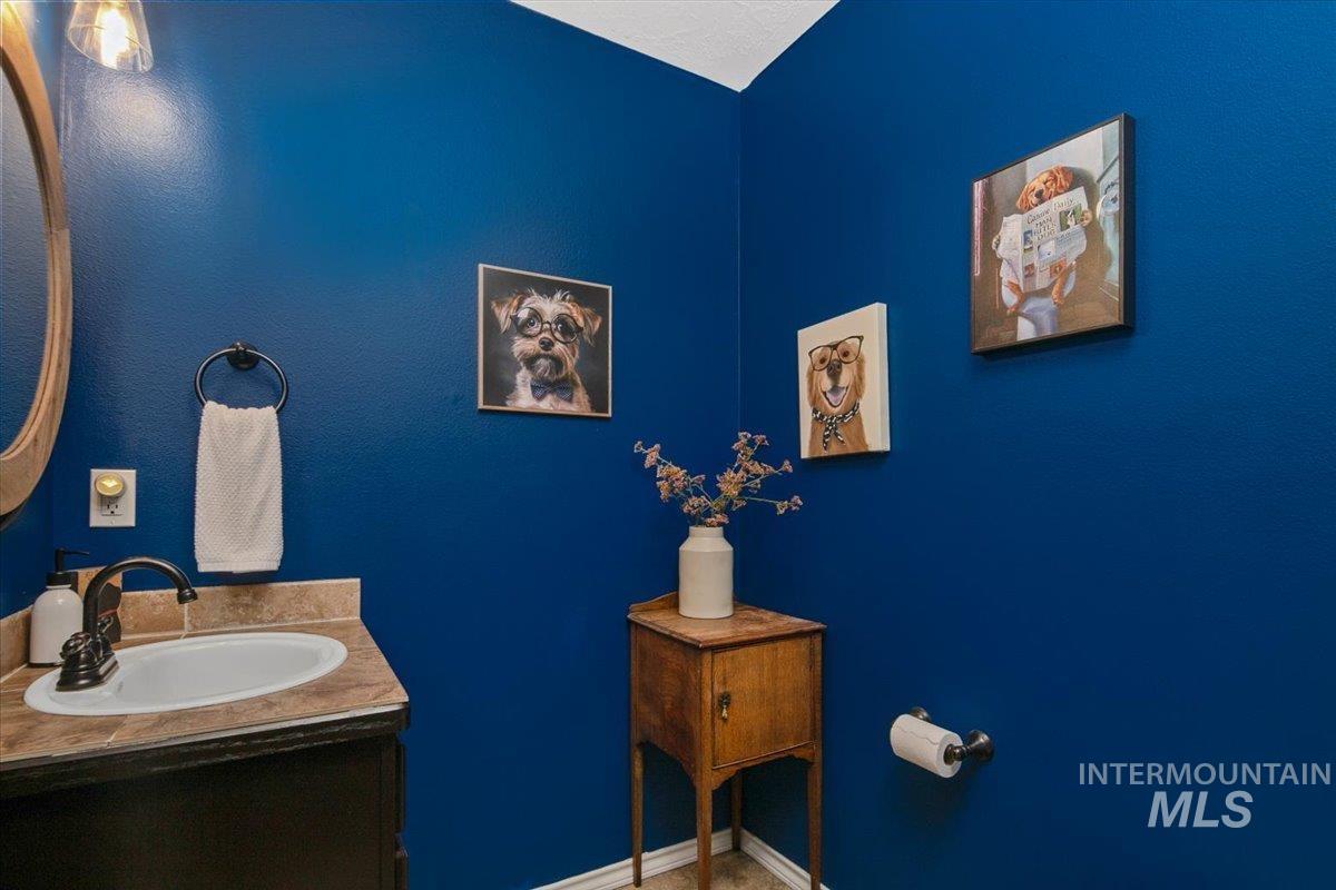Bathroom featuring vanity and baseboards
