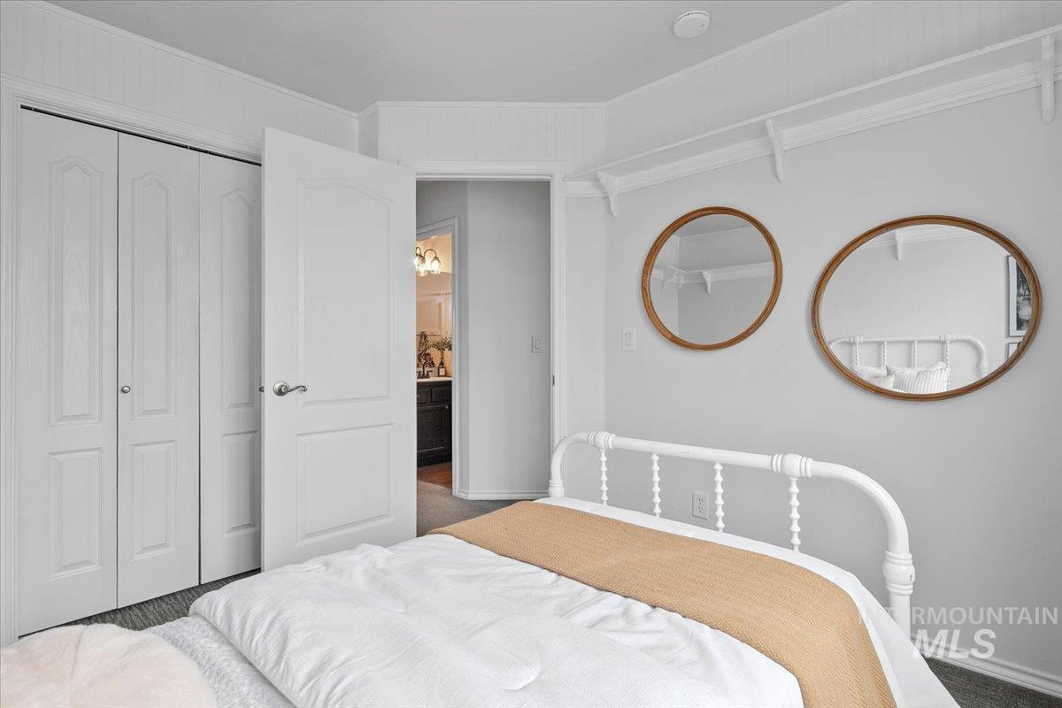 Bedroom featuring a closet and baseboards