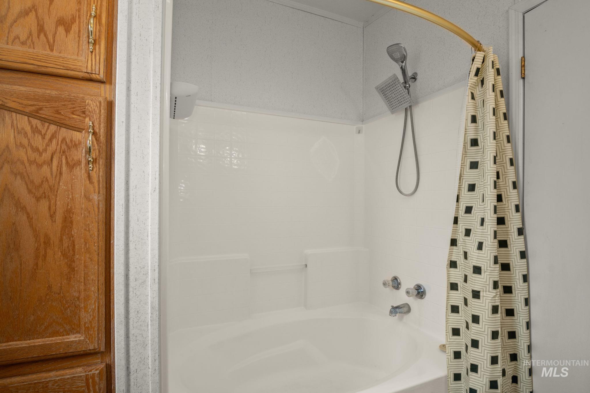 Bathroom featuring shower / tub combo