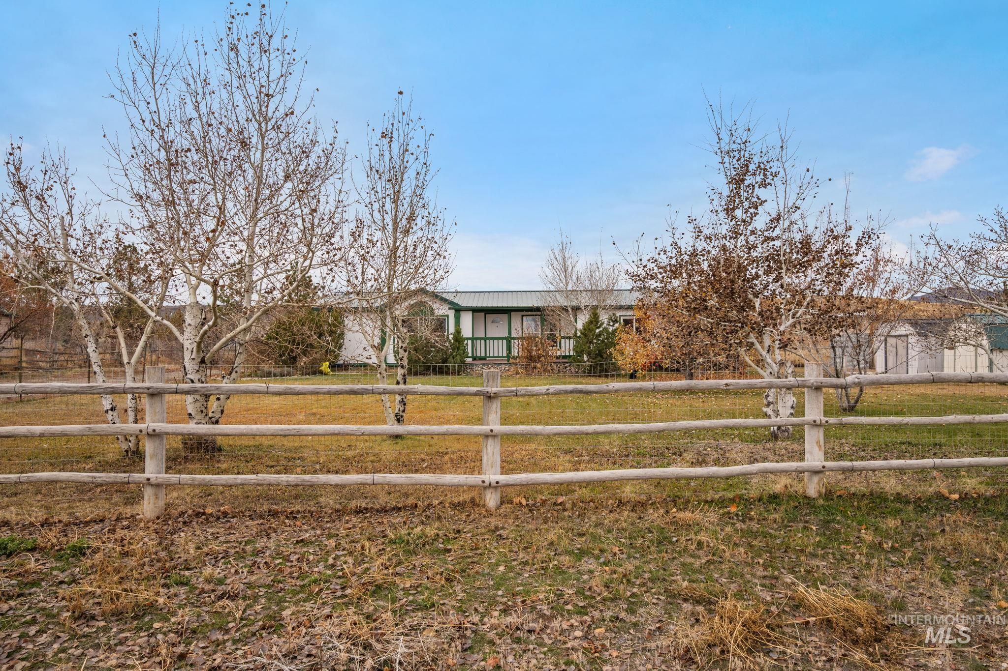 Single story home featuring a fenced front yard