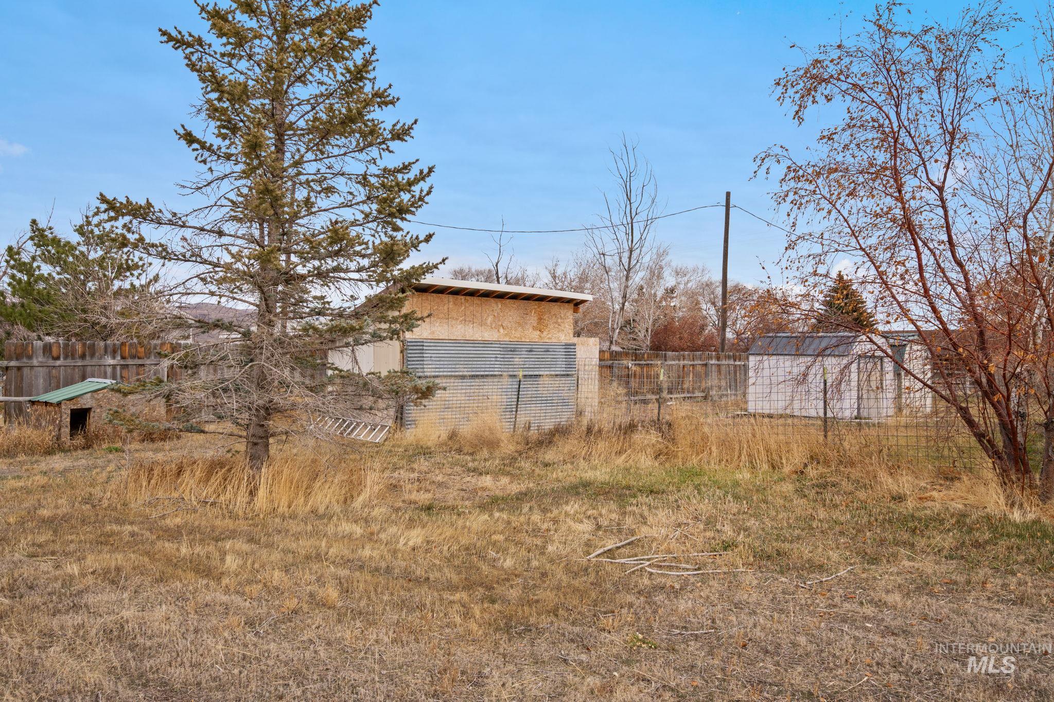 View of yard with an outdoor structure