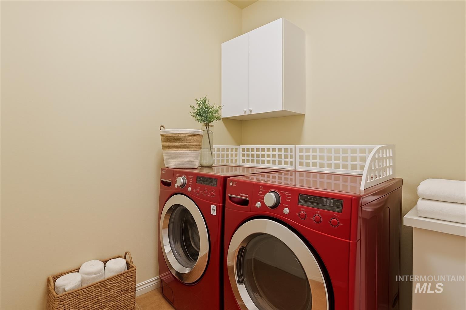 Laundry room featuring washer and dryer and cabinet space