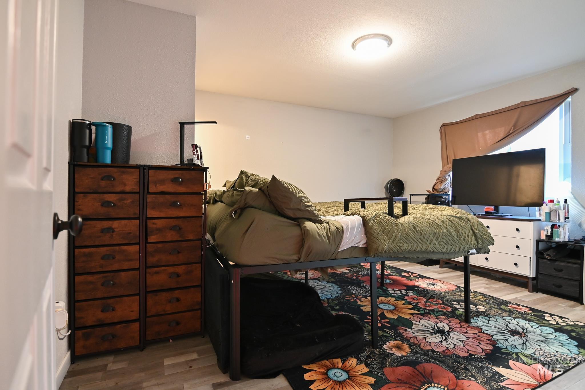 Bedroom with light wood-type flooring