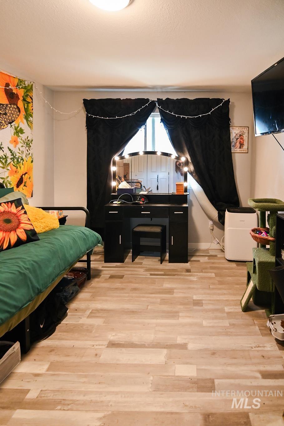 Bedroom with light wood finished floors