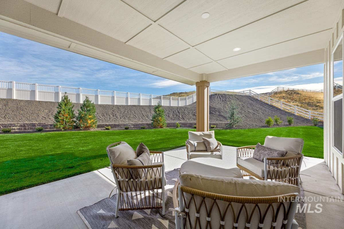Fenced backyard with outdoor lounge area and a patio area