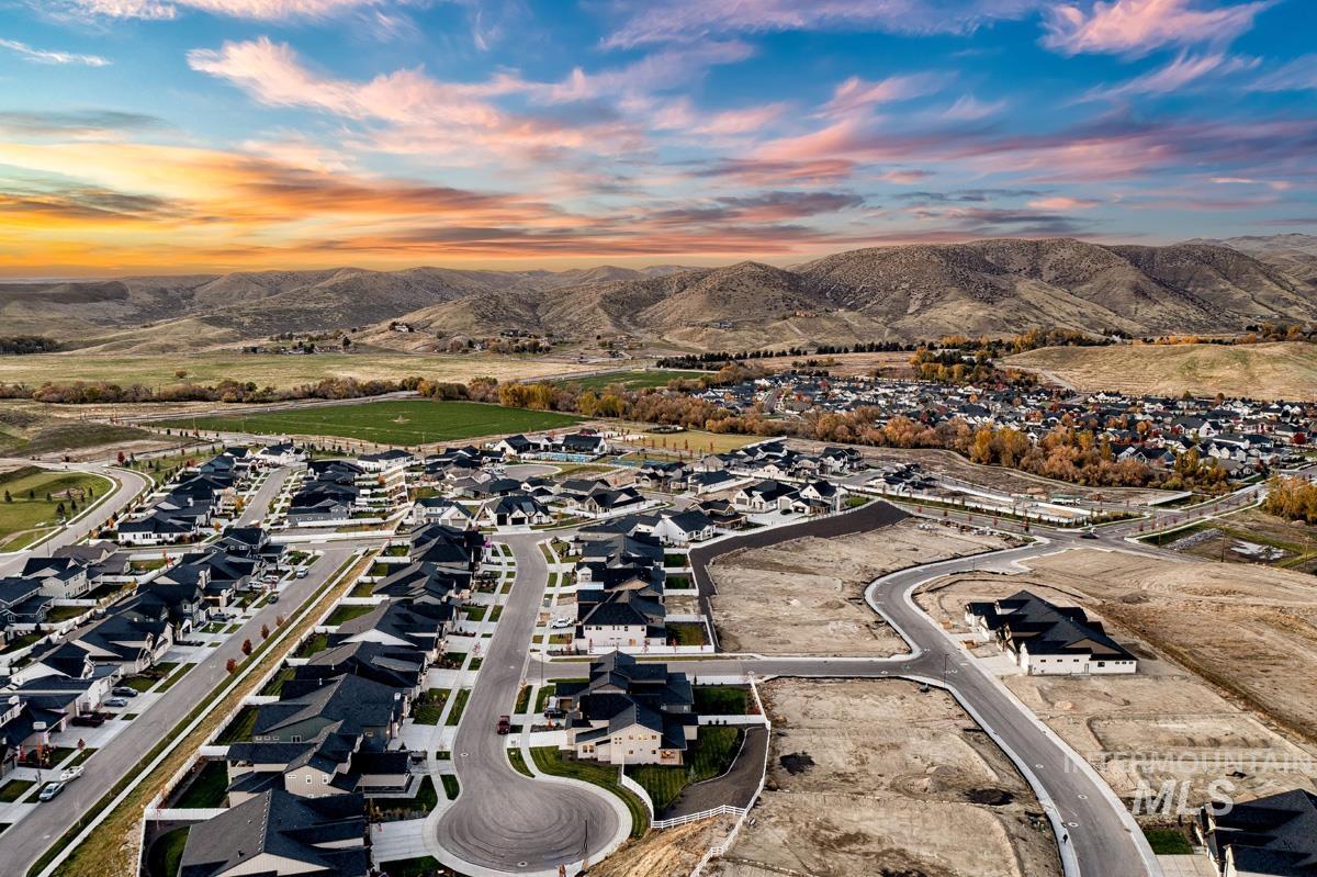 Aerial view of property's location featuring nearby suburban area