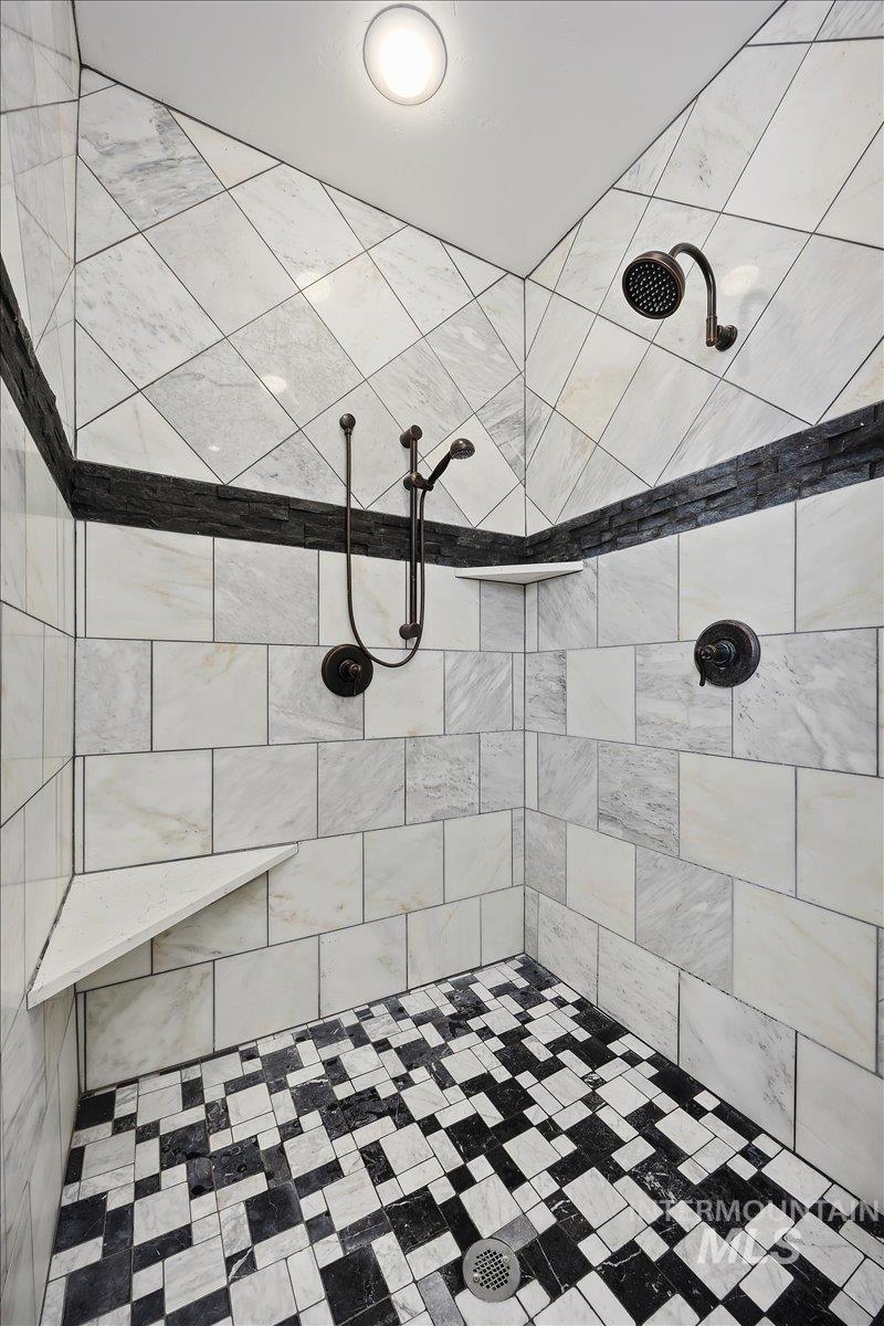 Full bathroom featuring a tile shower