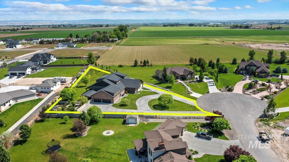 Aerial view of sparsely populated area featuring farmland
