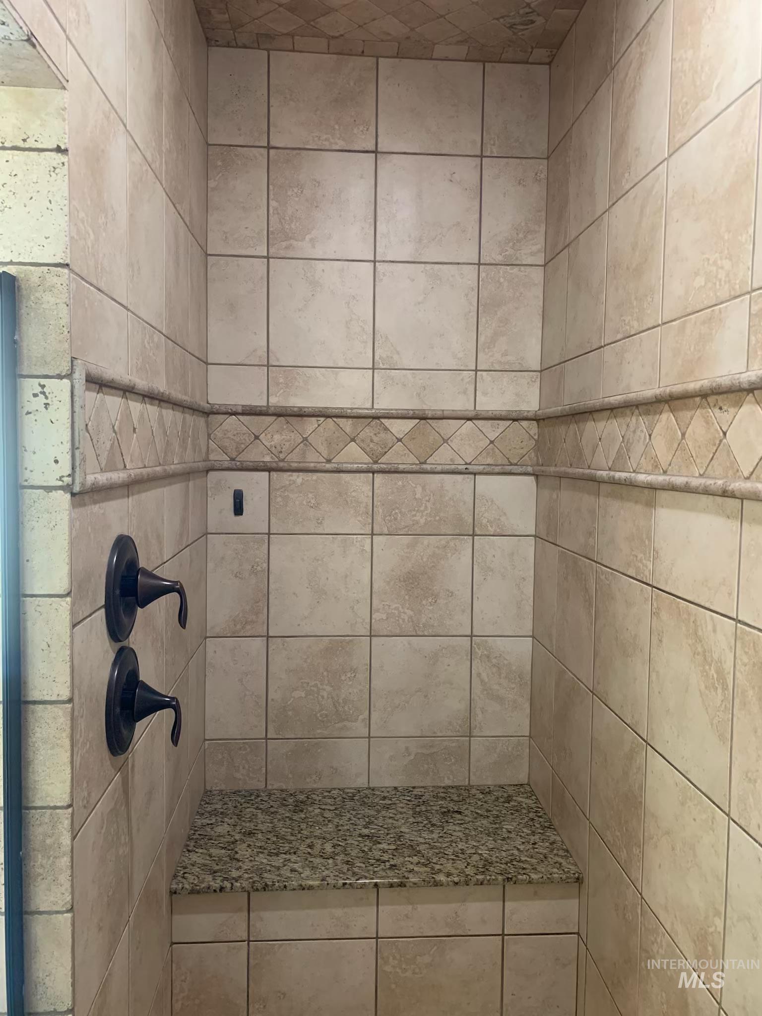 Bathroom with tiled shower