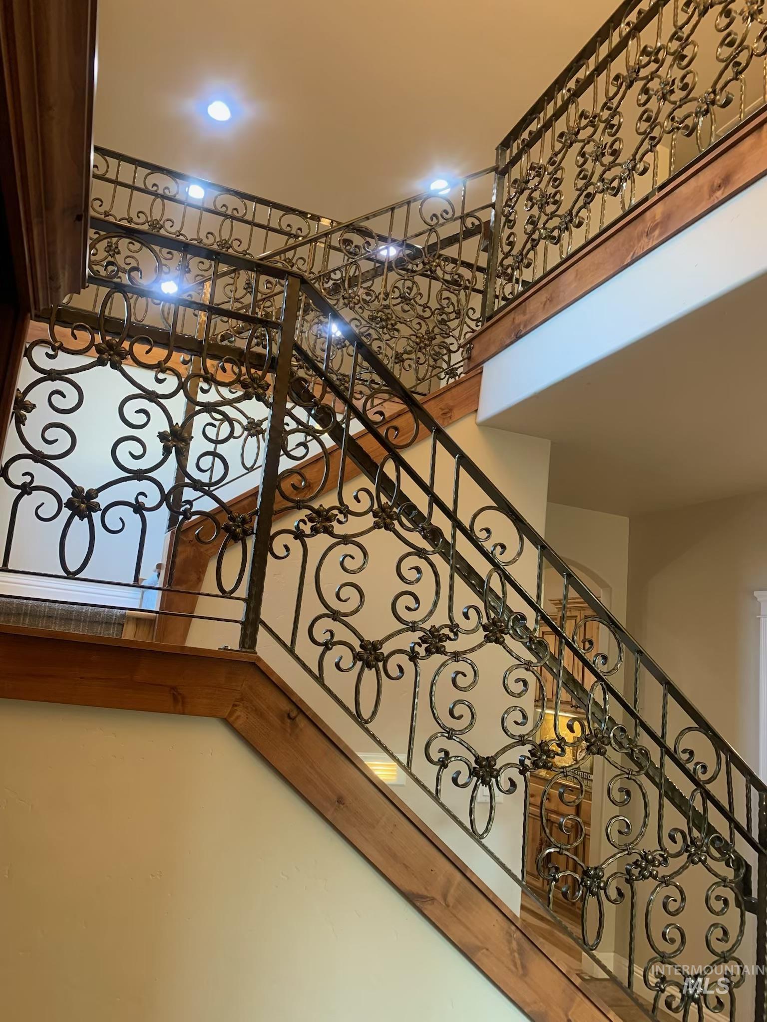Stairs featuring a towering ceiling
