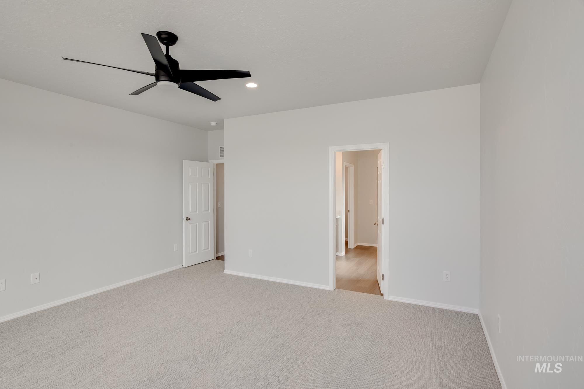 Unfurnished bedroom with ceiling fan, carpet flooring, and recessed lighting
