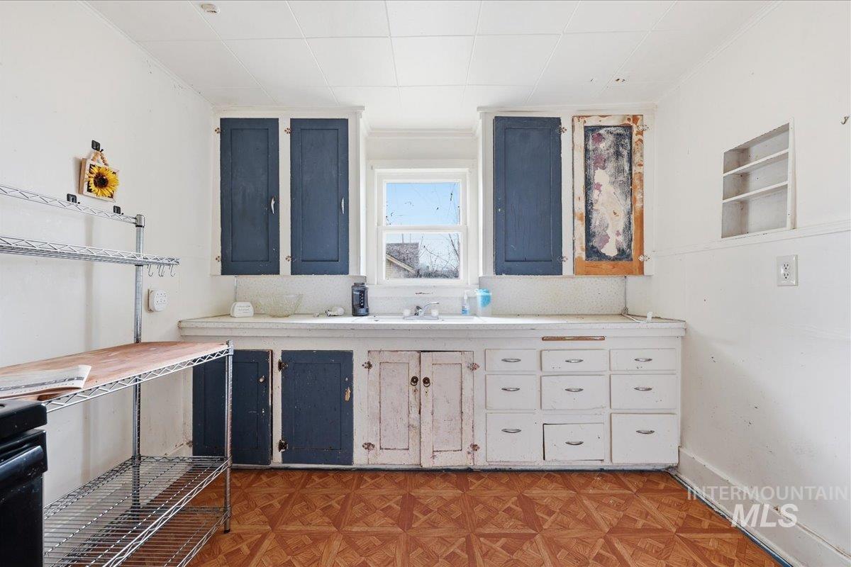 Kitchen with light countertops and baseboards