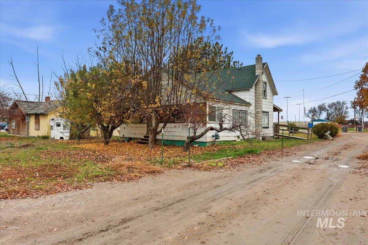 View of front of property featuring a chimney