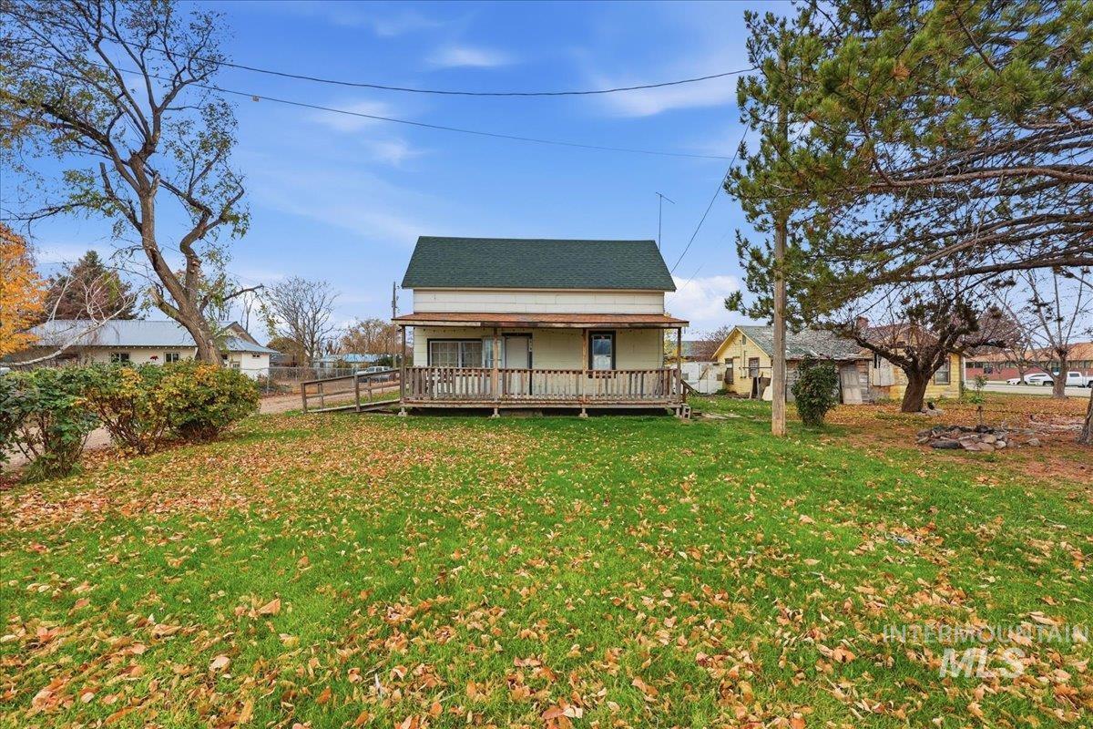 Rear view of house featuring a wooden deck