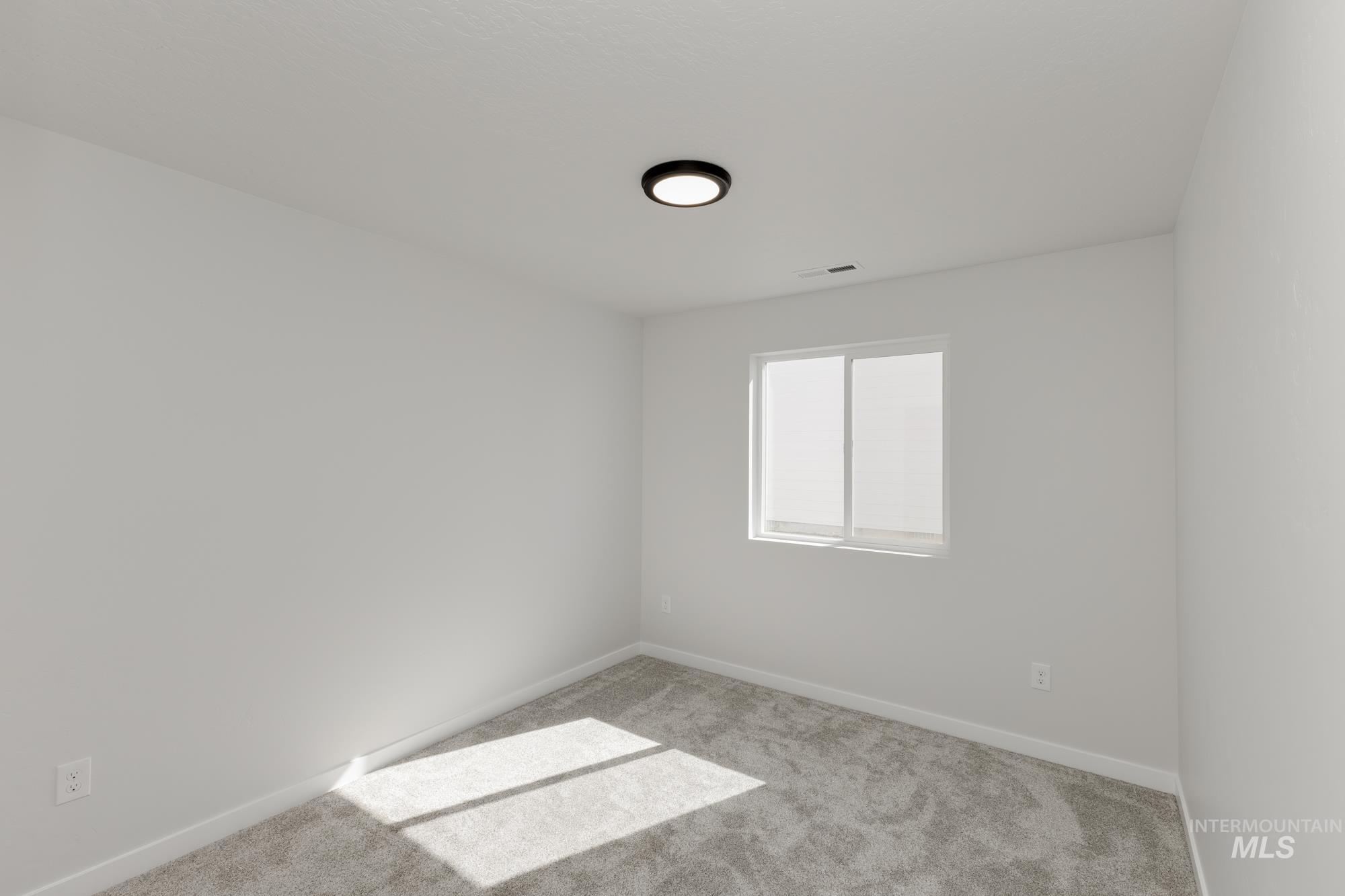 Unfurnished room featuring carpet floors