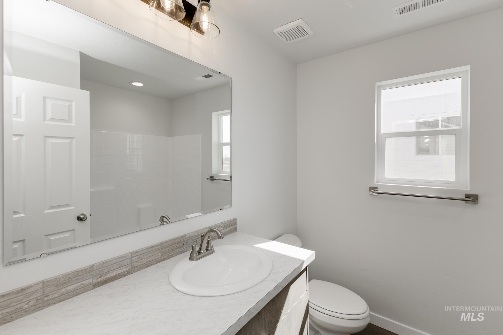 Full bathroom featuring vanity and a shower