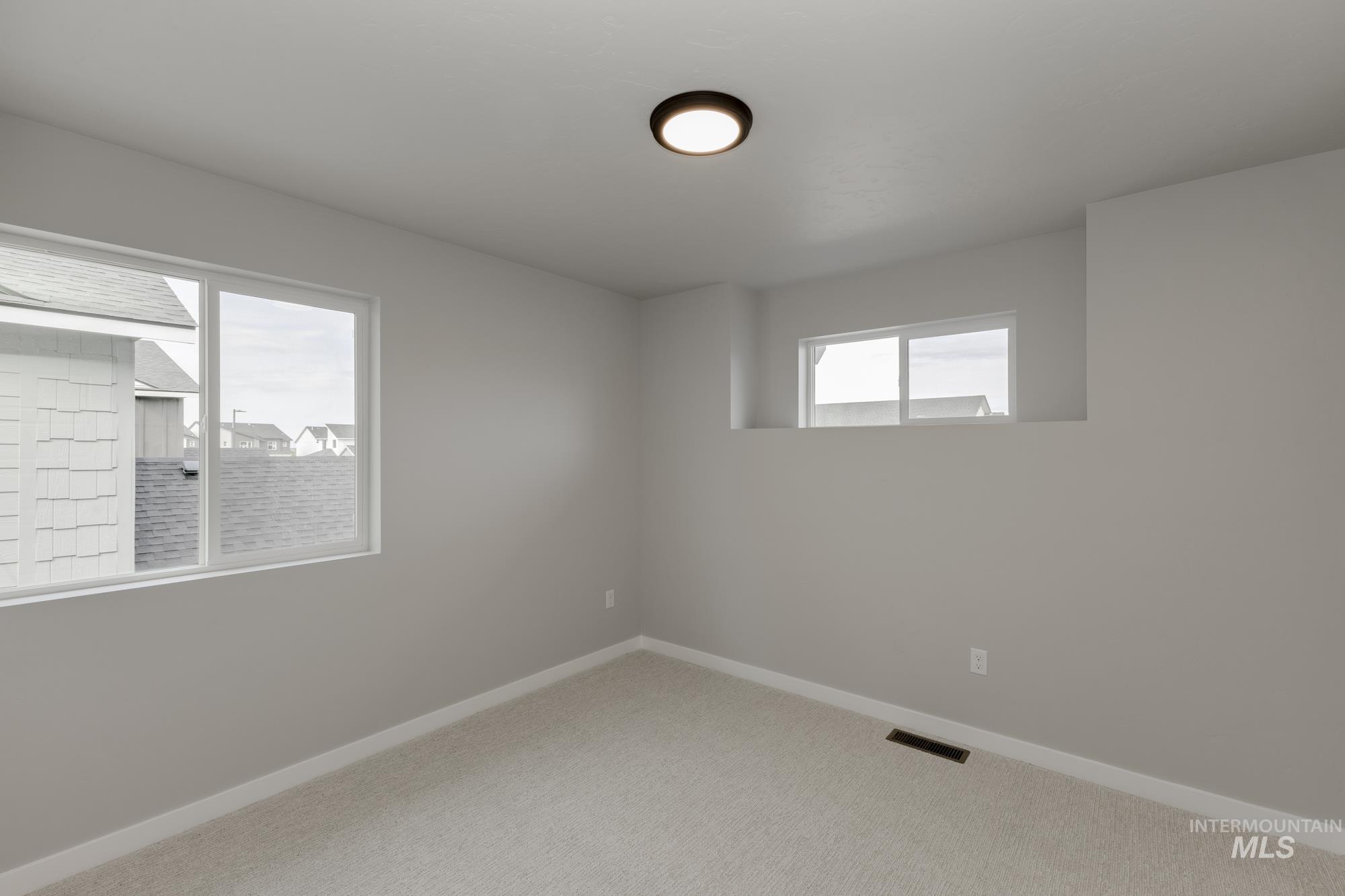 Empty room with carpet floors