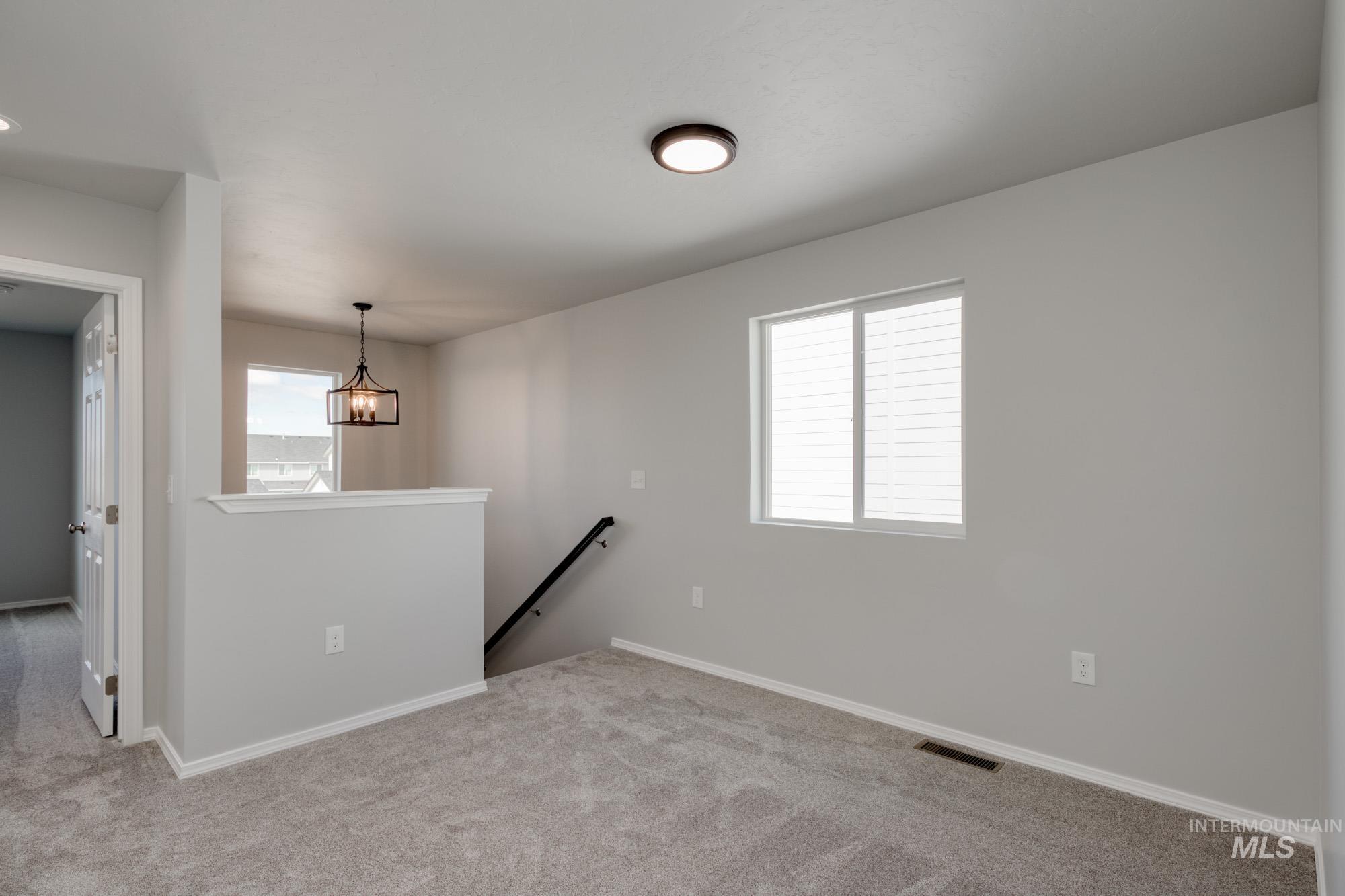Unfurnished room featuring carpet flooring