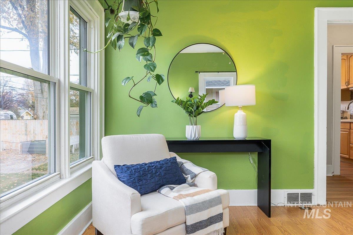 Living area featuring wood finished floors and baseboards