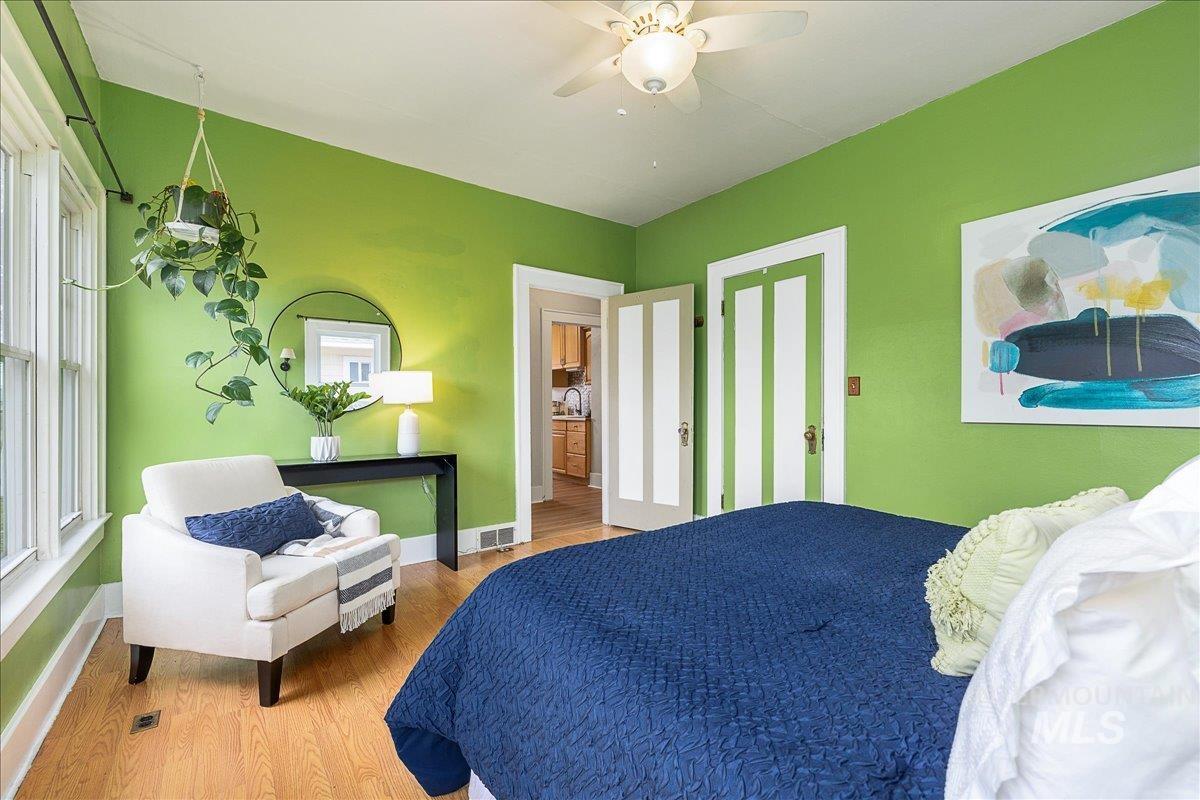 Bedroom featuring wood finished floors and ceiling fan