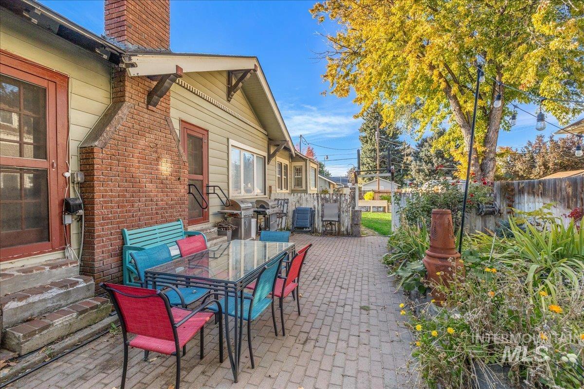 View of patio / terrace featuring outdoor dining space and a grill