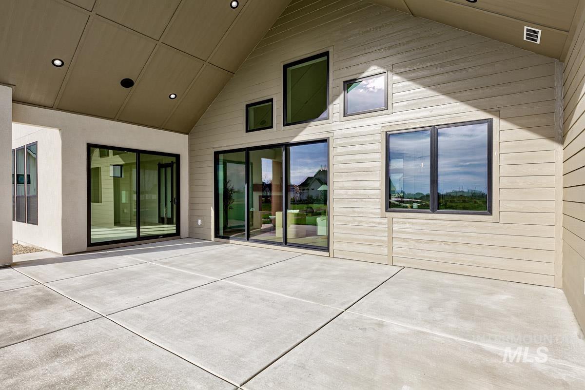 Back of property with a patio