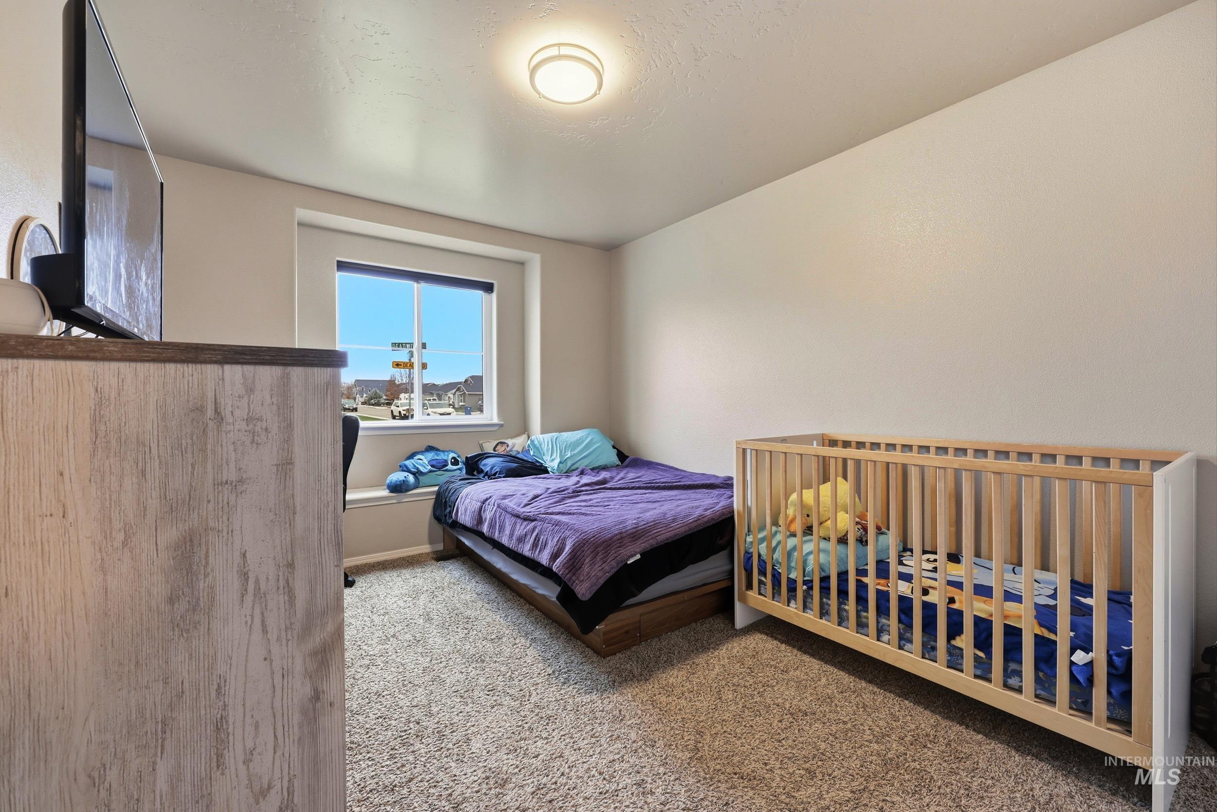 Bedroom featuring carpet