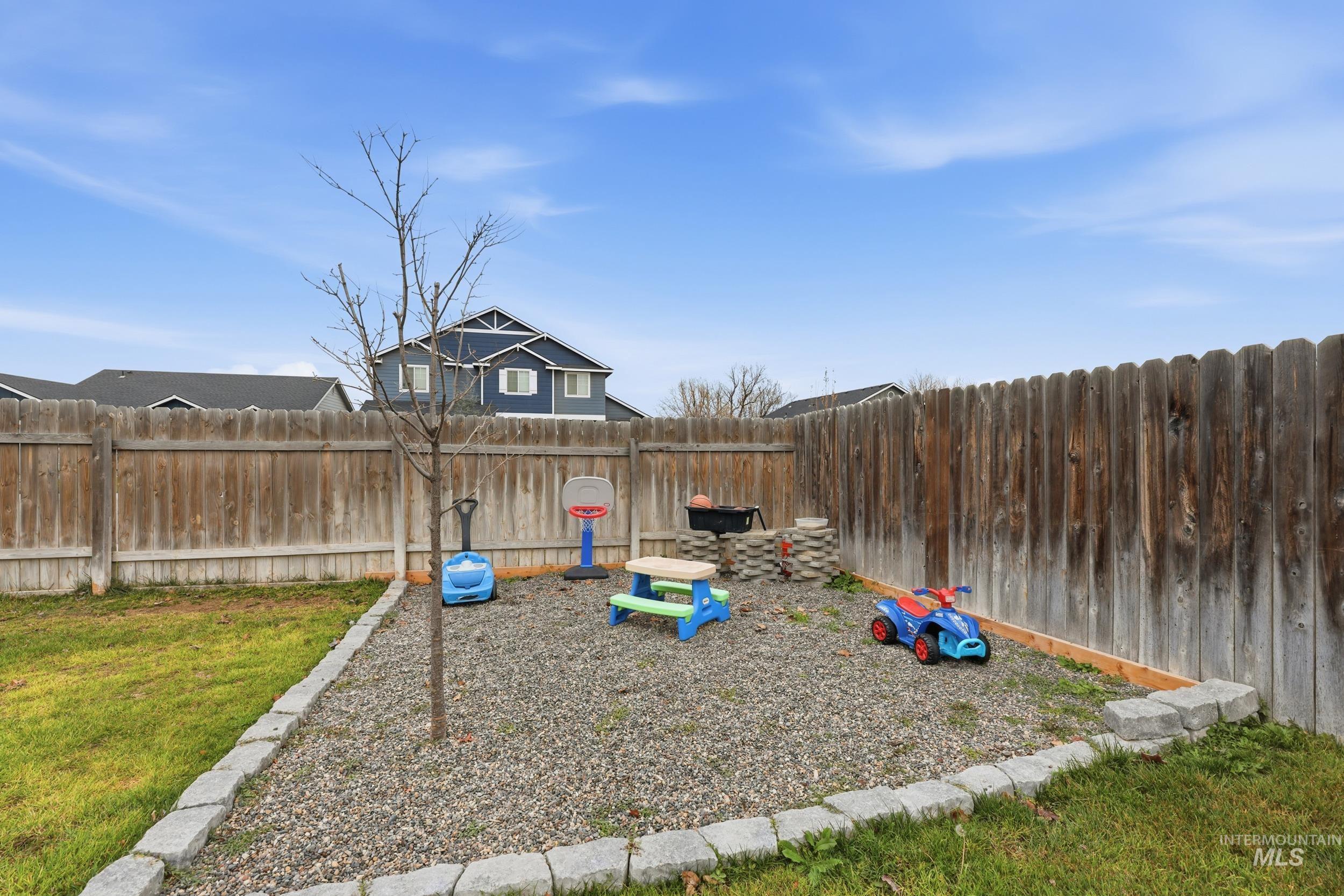 View of fenced backyard
