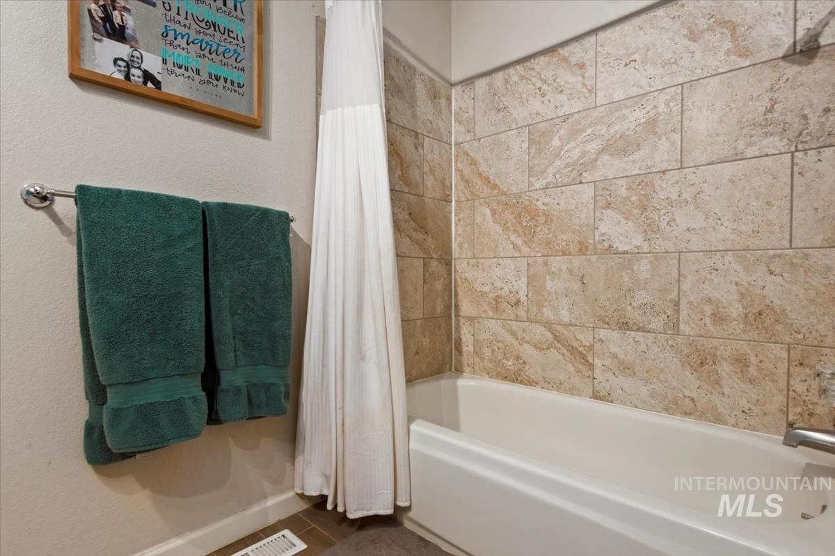 Bathroom featuring shower / tub combo